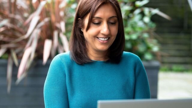 Me-at-laptop-Jaskiran-McPhail-scaled-1.jpg